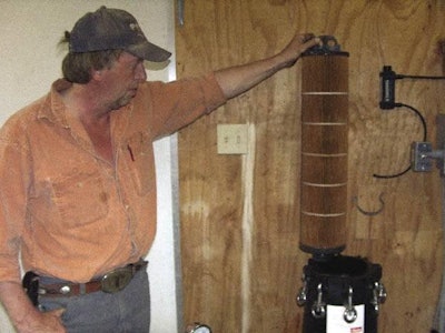The University of Arkansas’ Dr. Tabler demonstrates how the filter can be removed for cleaning.