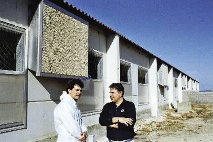 Dr Lorenzo Merino (at right), with Agric-Bemvig sales manager Ferran Meinhardt, started his herd in 2004 to produce piglets on contract inside cooled-air houses.