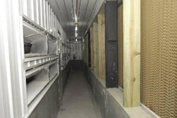 Wet-cell pads for this farrowing house are separated from the family rooms by a 1 m-wide corridor to act as an air tempering area. (Photos courtesy of Pigpro/OEM and AP/GSI)