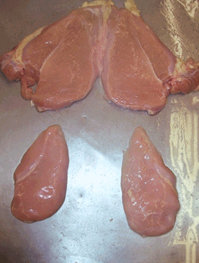 A volumetric portioner was used to produce these two sandwich size portions (below) and trim meat (above) from a breast meat butterfly.