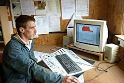 Checking piggery performance from the office. Farmer Anthony Williams logs in to look at environmental results in his finishing house.