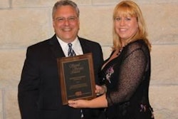 Stephen Campano accepts Signal Service Award from Lynn Graves Delmore of California Polytechnic State University.