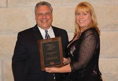 Stephen Campano accepts Signal Service Award from Lynn Graves Delmore of California Polytechnic State University.