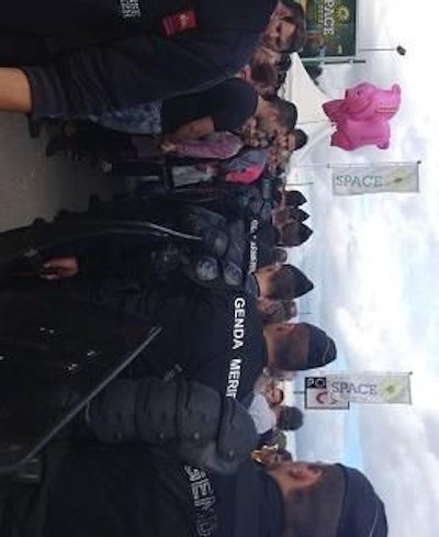 French Prime Minister Jean-Marc Ayrault spoke September 12 at SPACE in Rennes, France, as protesters, who criticize Ayrault during this unstable time for French animal agriculture, gather outside the expo.
