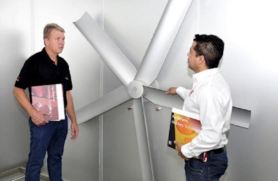 Rogério Stabelini, hatchery manager, Aviagen America Latina, left, and Leandro Pereira, installation technician, Pas Reform do Brasil, discuss the new hatchery project the two companies have been involved with. | Pas Reform