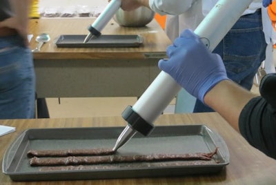 During the KSU Pet Food Experience and Petfood Innovation Workshop, participants learned about producing safe pet jerky treats, including a hands-on demonstration making jerky treats with kangaroo meat. l Debbie Phillips-Donaldson