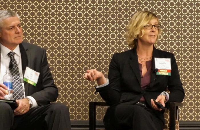 Jennifer Tirey (right), executive director of the Illinois Pork Producers, speaks about her experience handling a series of stories critical to the pork industry.