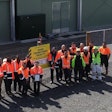 Members of the Cobb team stand outside of the Avian Transitional Facility in New Zealand. | Photo courtesy of Cobb-Vantress