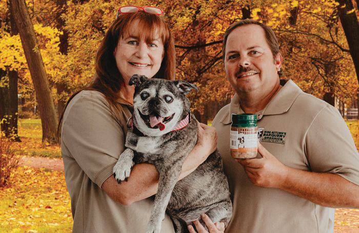 Victoria McDowell, CEO, here with Chief Operations Officer Jim Maciborski and Missy Mulligan McDowell the Bugg (Terrier/Pug mix) looks to constantly improve her company&rsquo;s selections to help dog owners maintain optimal health for their pets. | Photo courtesy Miss Autumn&rsquo;s Barquery