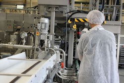 A workshop participant examines a Clextral extruder during the Animal Feed Extrusion Course on October 16, 2018 in Saint-Etienne, France. | photo courtesy Clextral