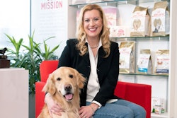 Kamie Eckert, here with her Golden Retriever Baxter, leads a team of 1,000 employees as president and general manager Royal Canin USA. l (Courtesy of Royal Canin)
