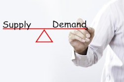 Businessman hand drawing supply and demand balance concept.