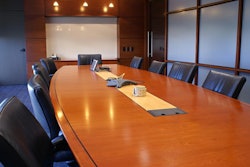Meeting room with chairs and a white board.