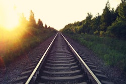 bigstock-Rail-Road-At-Sunset-Summer-Bea-255160534