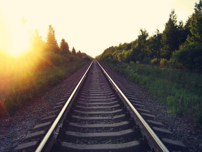 bigstock-Rail-Road-At-Sunset-Summer-Bea-255160534