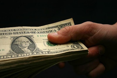 holding-money-one-dollar
