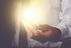 man-holding-lightbulb