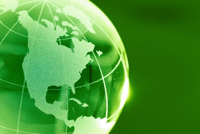 Shiny glass globe in green showing North America