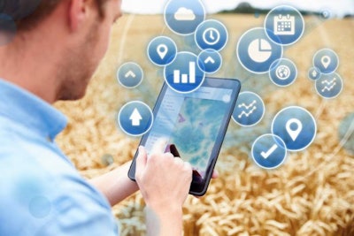 Composite Of Farmer In Field Accessing Data On Digital Tablet