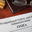 Occupational Safety and Health Administration OSHA and a book.