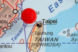Close-up of a red pushpin in a map of Taipei, Taiwan.
