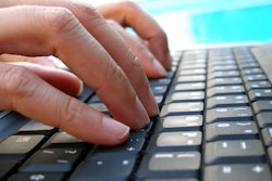 Fingers Typing On Computer Keyboard