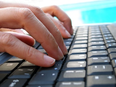 Fingers Typing On Computer Keyboard