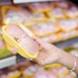 Meat In Food Store . Woman Choosing Packed Fresh Chicken Meat In