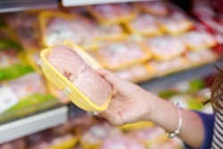 Meat In Food Store . Woman Choosing Packed Fresh Chicken Meat In