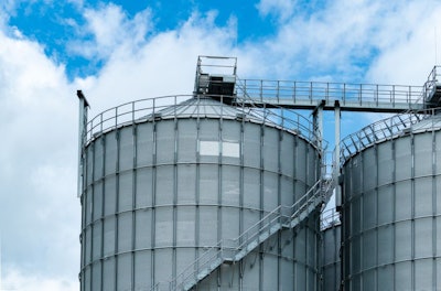 Agricultural Silo At Feed Mill Factory. Big Tank For Store Grain