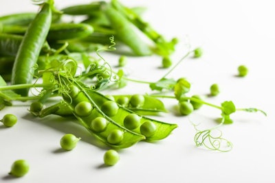 Fresh green peas pods and green peas with sprouts on white wo