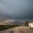 A Shelf Cloud And Storm Approach Old Farm Buildings In The Midwe