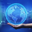 Global Economy. Female Hand Holding World Globe Over Blue Backgr
