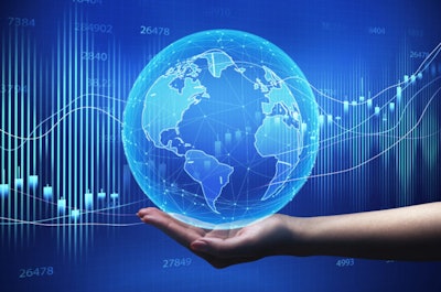 Global Economy. Female Hand Holding World Globe Over Blue Backgr