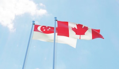 Singapore and Canada, two flags waving against blue sky. 3d image