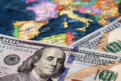 Us Dollars On The Map Of Europe. Concept Of Trade Between The Un