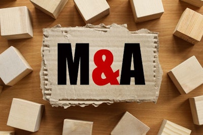 M And A Merger And Acquisition. Text On Torn Cardboard On Wood C