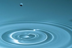 Falling water drop splash Waves on the surface of the water from