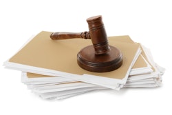 Yellow Files With Documents And Wooden Gavel On White Background