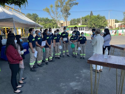 Staff at ADM's Pet Solutions pet food plant in Guadalajara, Mexico, prepare for a ceremony to announce a production expansion.