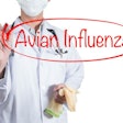 Doctor using red pen draw circle on avian influenza
