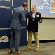 David Toland, Kansas Lieutenant Governor & Secretary of Commerce, presents the Award to Michael Hinton, AgTrax director of Sales & Marketing. Photo: AgTrax
