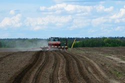 Red Tractor In A Field Rear View, Tractor Planting Crops On An A