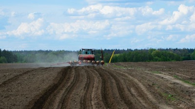 Red Tractor In A Field Rear View, Tractor Planting Crops On An A