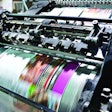 Detail shot of the workings of a printing factory. The commercial designs displayed in this image represent a simulation of a real product and have been changed or altered enough by our team of retouching and design specialists so that they are free of any copyright infringements