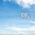 Co2 Symbol On Blue Sky And White Clouds. Co2 Emissions. Greenhou