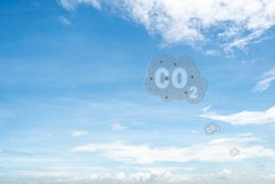Co2 Symbol On Blue Sky And White Clouds. Co2 Emissions. Greenhou