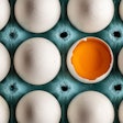 Organic Fresh Chicken Eggs Arranged In Egg Tray. Half Broken Egg