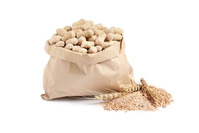 Granulated Wheat Bran In Bag And Spikelets On White Background