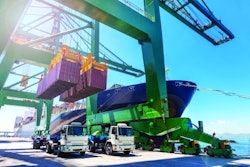 Crane unloading two containers